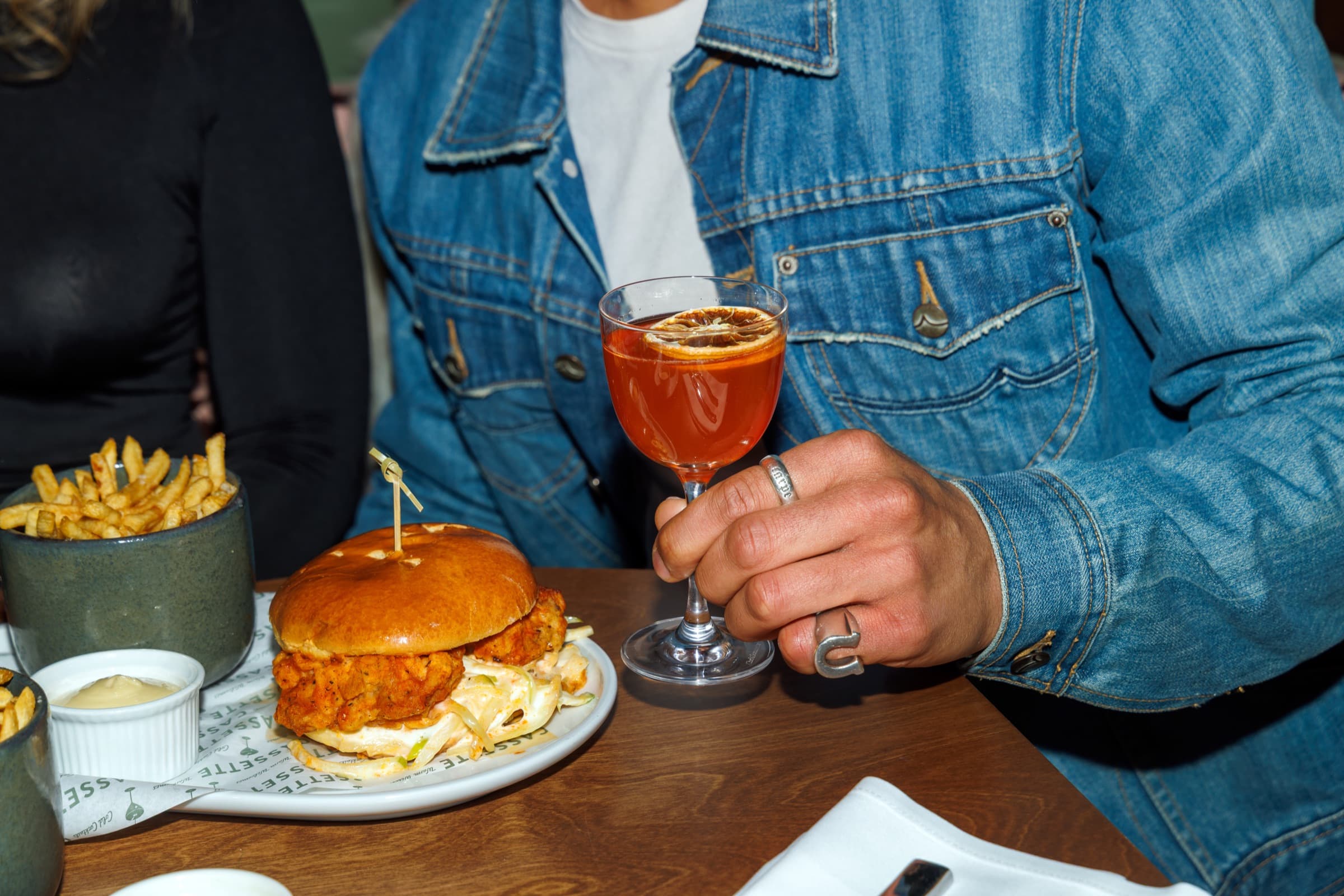 A burger and an orange spritz at Cassette